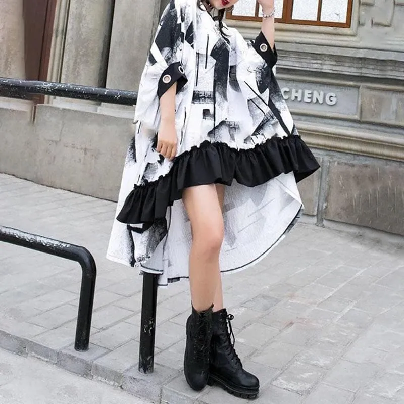 Cape-Like Dress With Ruffled Hem And Abstract Print