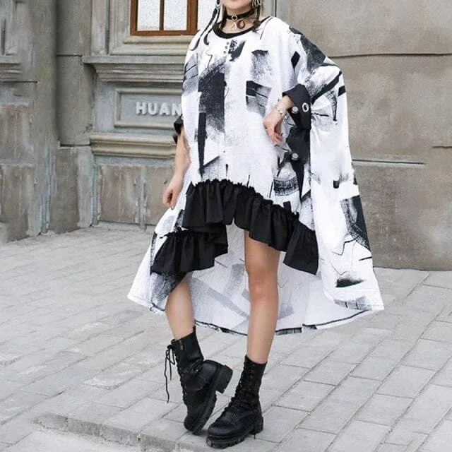 Cape-Like Dress With Ruffled Hem And Abstract Print